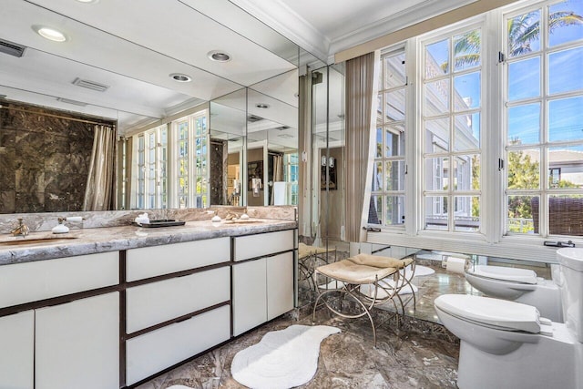 bathroom featuring tile floors, crown molding, toilet, and double sink vanity