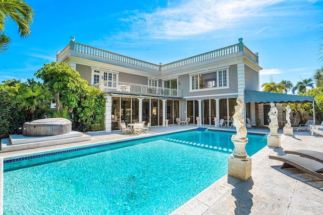 view of swimming pool with a patio area