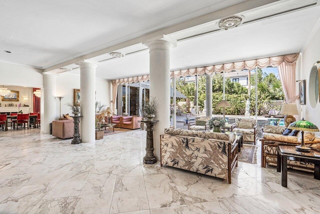 living room with ornate columns, tile floors, and crown molding