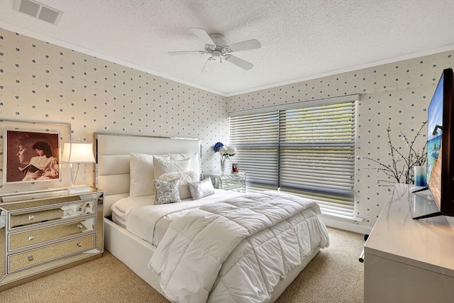 carpeted bedroom featuring a textured ceiling and ceiling fan