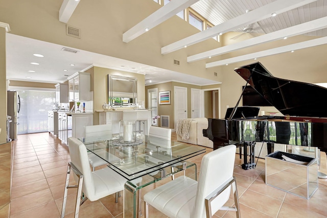 tiled dining area with beamed ceiling