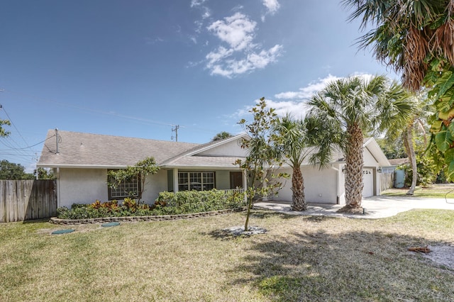 ranch-style home with a garage and a front yard