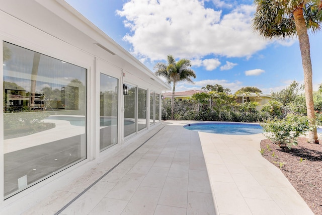 view of swimming pool with a patio