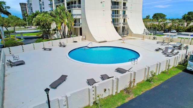 view of swimming pool with a patio area