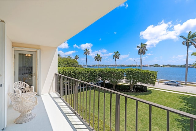 balcony featuring a water view