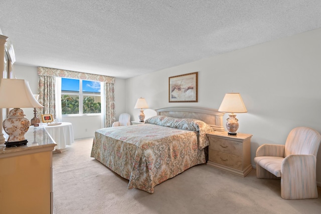 carpeted bedroom featuring a textured ceiling