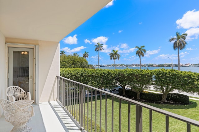 balcony featuring a water view