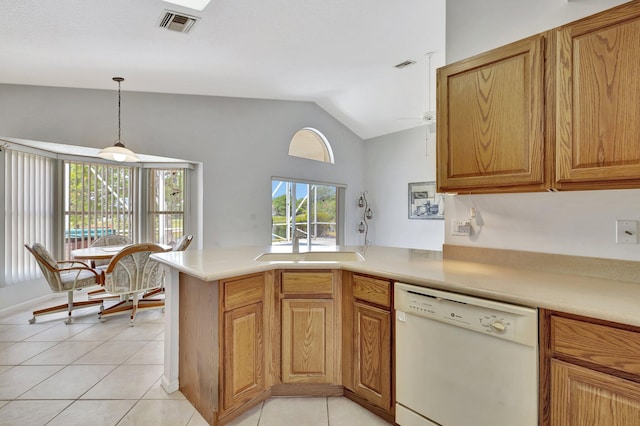 kitchen featuring hanging light fixtures, dishwasher, vaulted ceiling, and light tile flooring