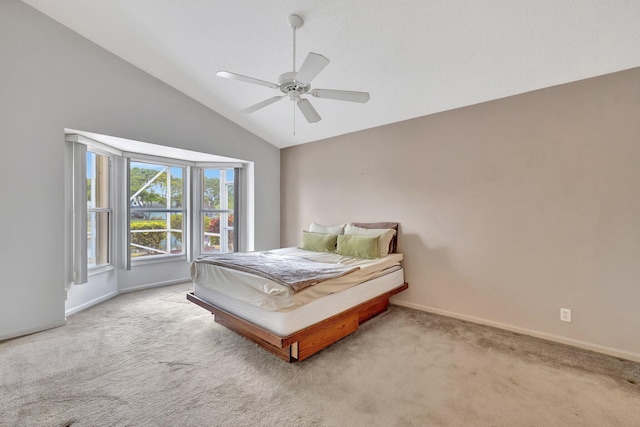 bedroom with high vaulted ceiling, ceiling fan, and carpet flooring