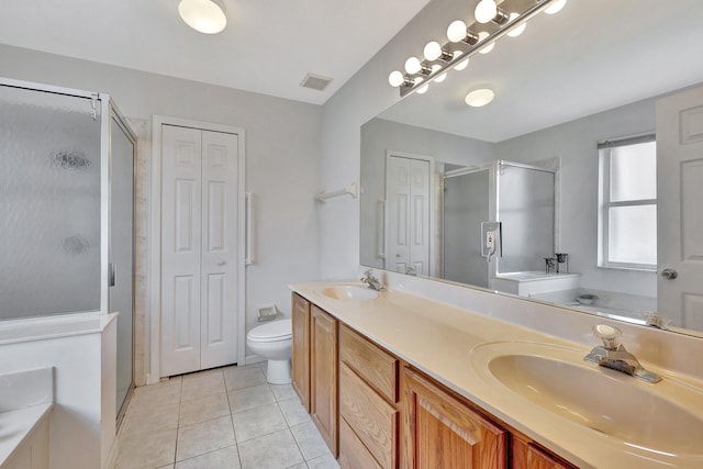 bathroom featuring oversized vanity, walk in shower, toilet, tile flooring, and dual sinks