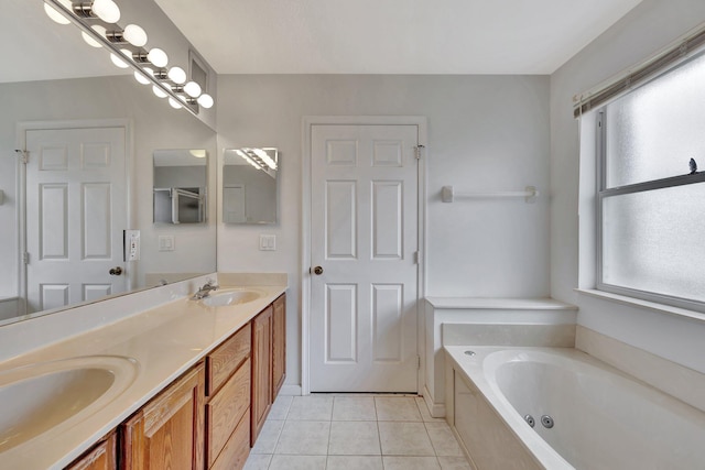 bathroom featuring dual sinks, tile floors, oversized vanity, and a tub