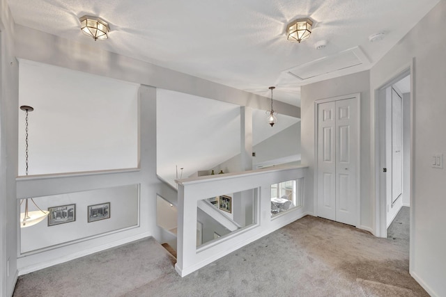 interior space with carpet and lofted ceiling with beams