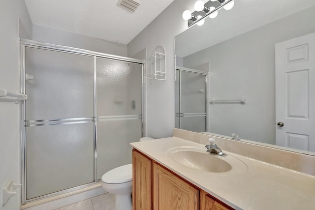 bathroom featuring an enclosed shower, toilet, tile floors, and vanity