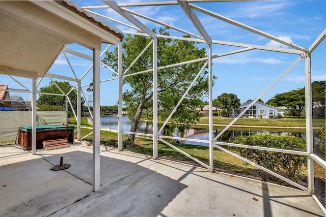 unfurnished sunroom with a water view