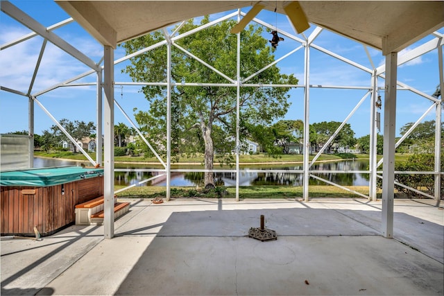 unfurnished sunroom with a water view