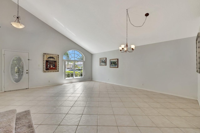 unfurnished living room with high vaulted ceiling, light tile flooring, and a chandelier