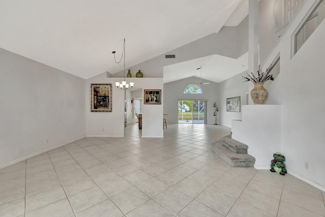 unfurnished living room featuring high vaulted ceiling, a notable chandelier, and light tile flooring