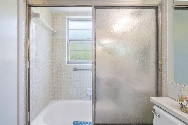 full bathroom with vanity, toilet, and bath / shower combo with glass door