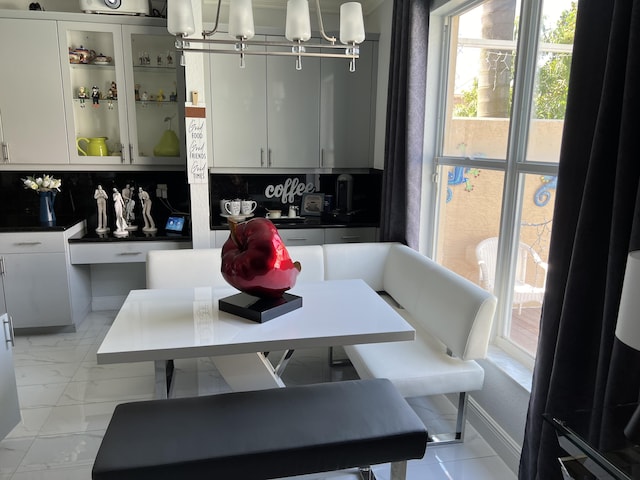 dining area with marble finish floor