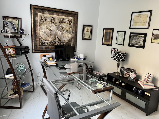 office area featuring marble finish floor