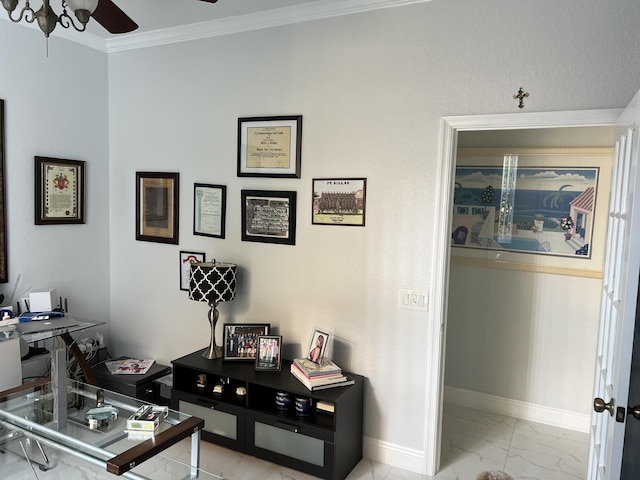 office area with ornamental molding, marble finish floor, baseboards, and a ceiling fan