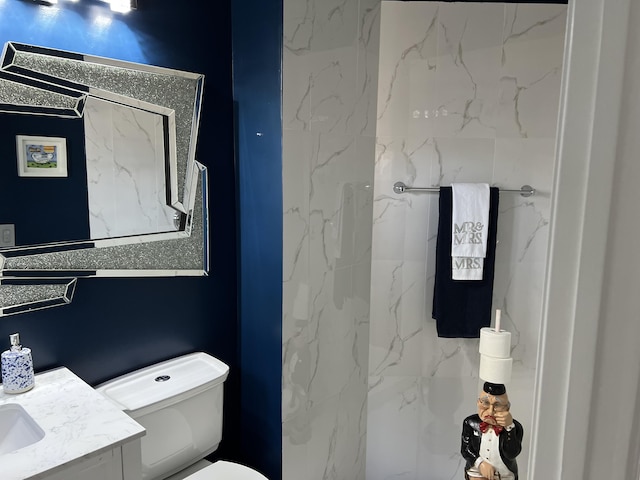 bathroom with toilet and vanity