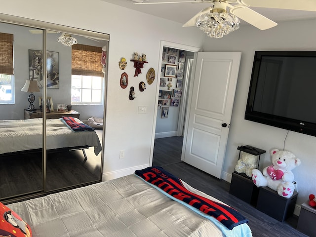 bedroom with baseboards, a closet, and ceiling fan