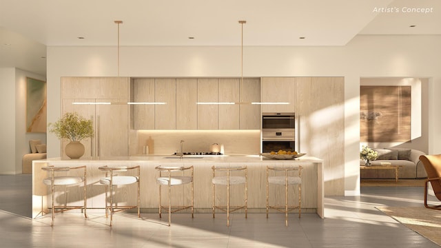 kitchen featuring tasteful backsplash, sink, a breakfast bar, and light brown cabinets