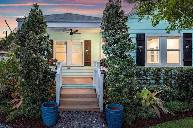 exterior entry at dusk with ceiling fan