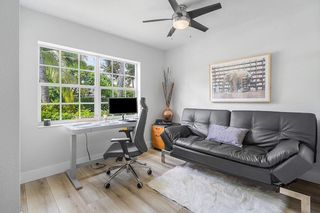 office featuring light wood-type flooring and ceiling fan