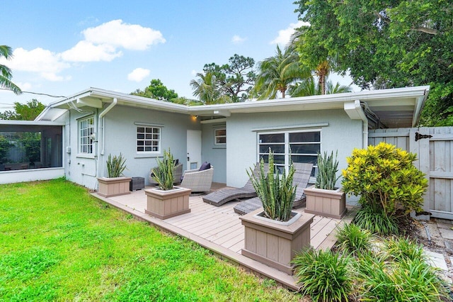 back of house with a lawn