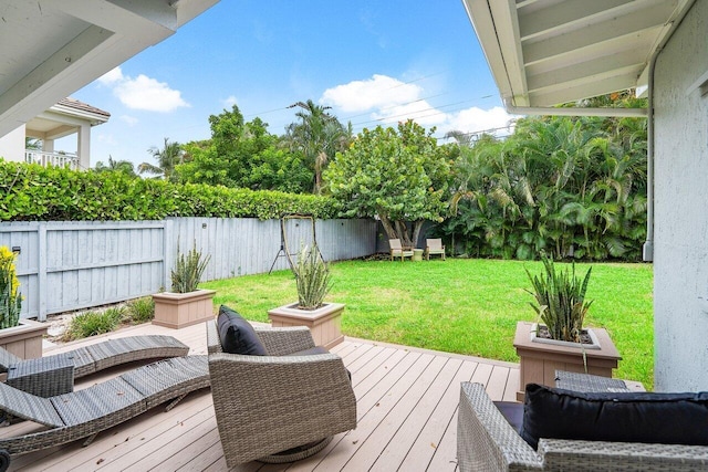 wooden terrace with a yard