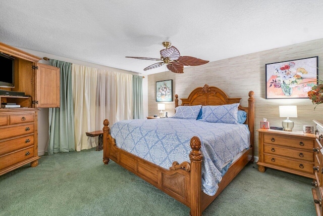 carpeted bedroom with ceiling fan and a textured ceiling