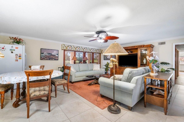 living room featuring ornamental molding, ceiling fan, and light tile flooring