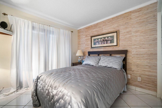 bedroom featuring ornamental molding, a textured ceiling, and light tile flooring