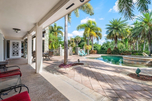 view of patio / terrace with a fenced in pool