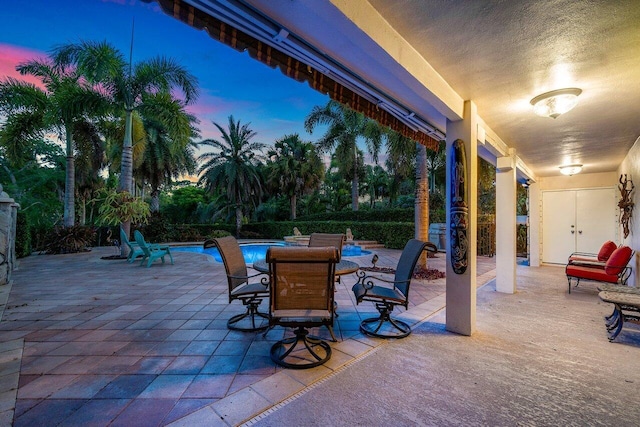 view of patio terrace at dusk