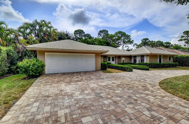 ranch-style house featuring a garage