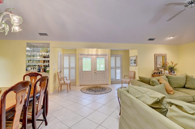 tiled living room featuring ceiling fan