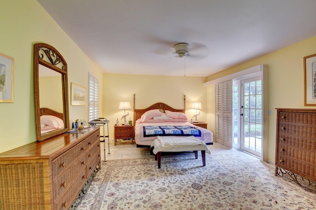 bedroom featuring tile flooring, ceiling fan, and access to exterior