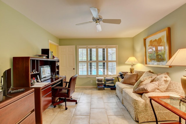 tiled office space featuring ceiling fan