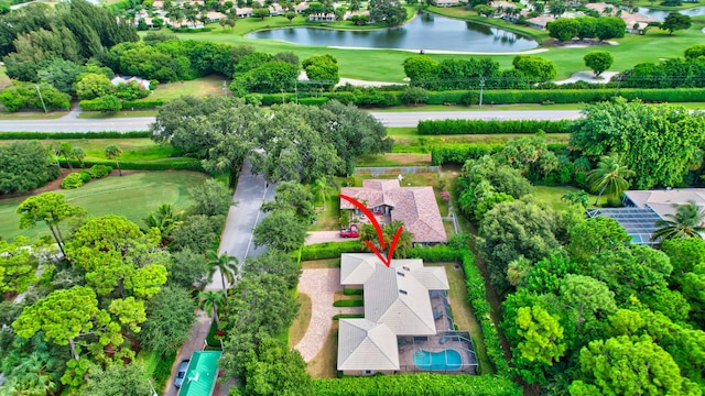 birds eye view of property with a water view