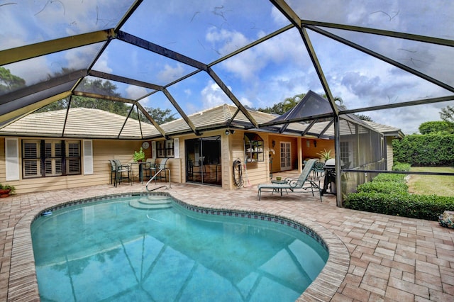 view of pool featuring a lanai and a patio area