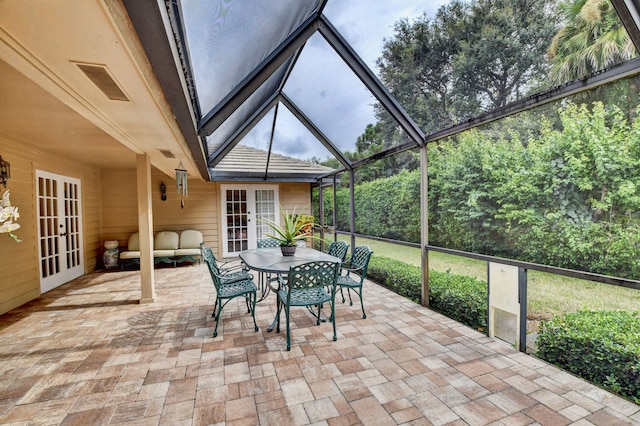 unfurnished sunroom featuring french doors