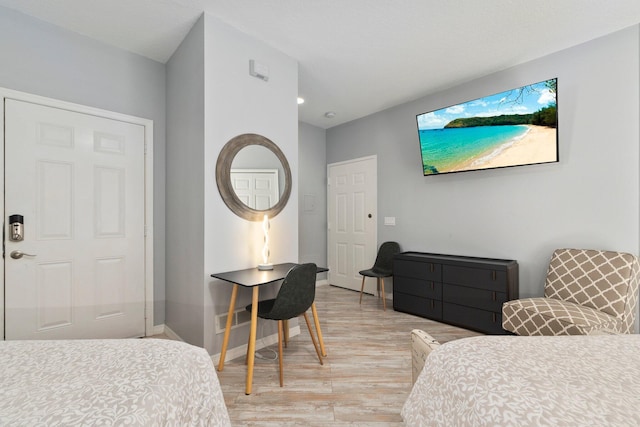 bedroom with light wood-type flooring