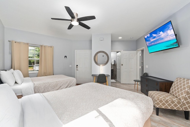 bedroom featuring light hardwood / wood-style flooring and ceiling fan