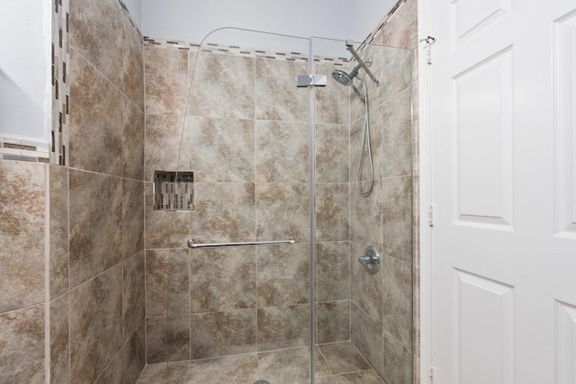 interior space with tiled shower