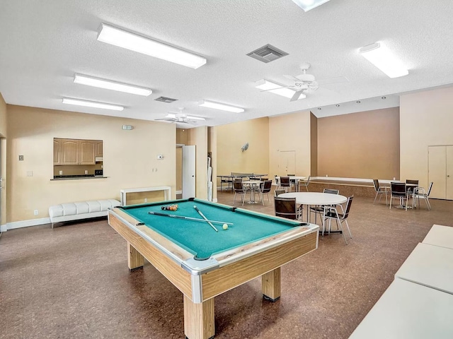 rec room with ceiling fan, a textured ceiling, and billiards