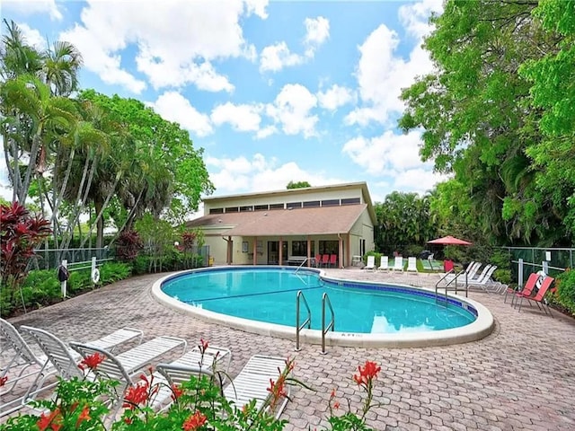 view of swimming pool with a patio