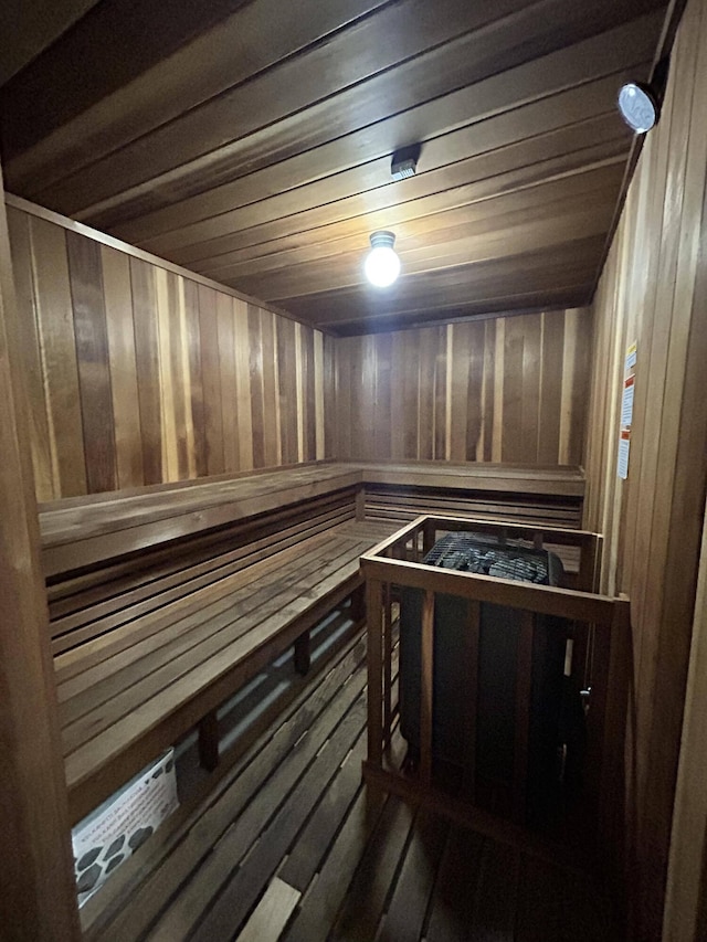 view of sauna / steam room with wood walls